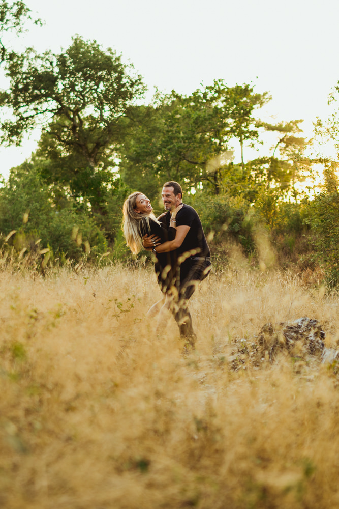 Young couple in love during engagement session in the wild